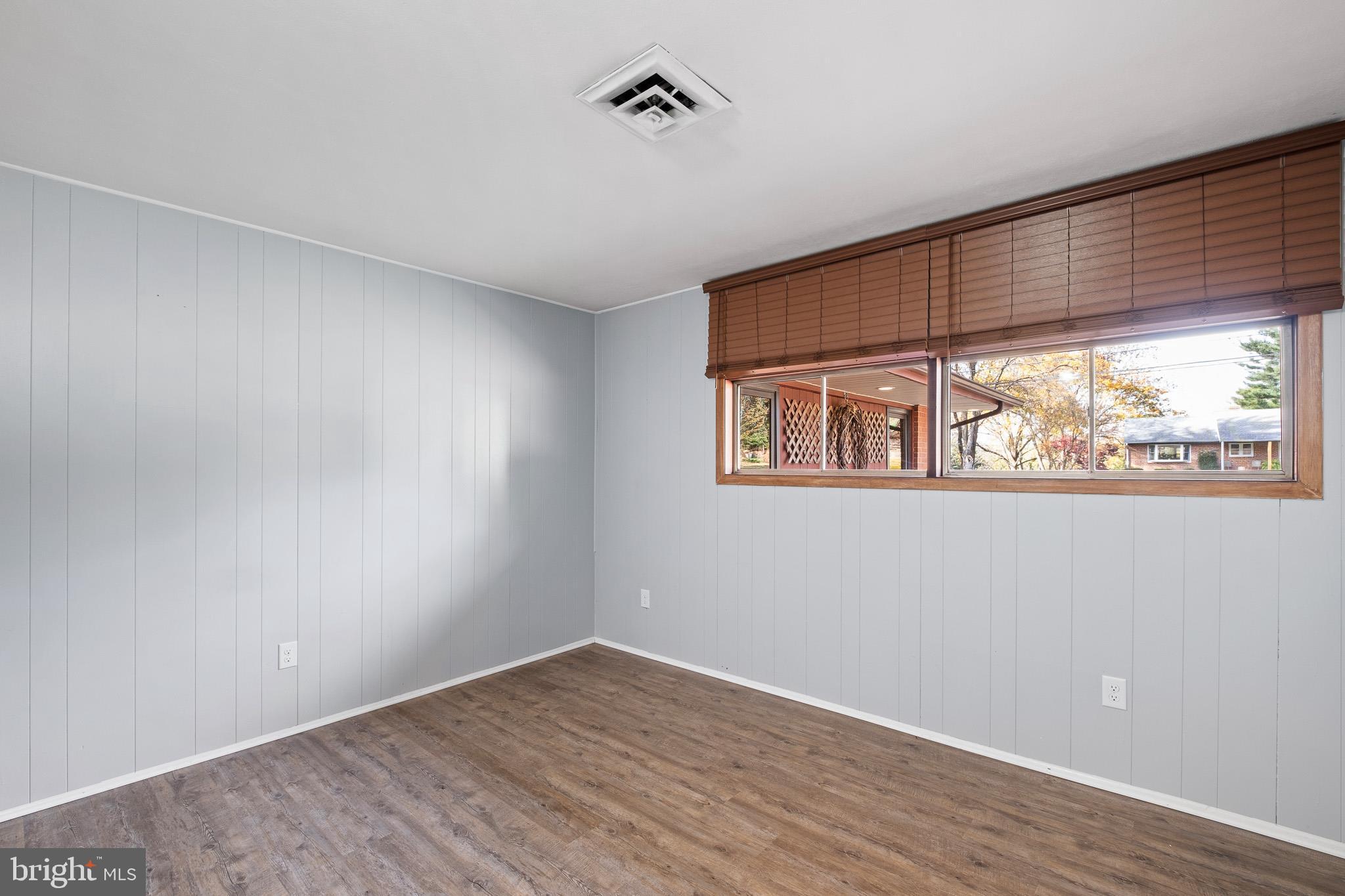 123 Unami Trail Newark, DE 19711 - Photo 29 of 31 an empty room with wooden floor and windows