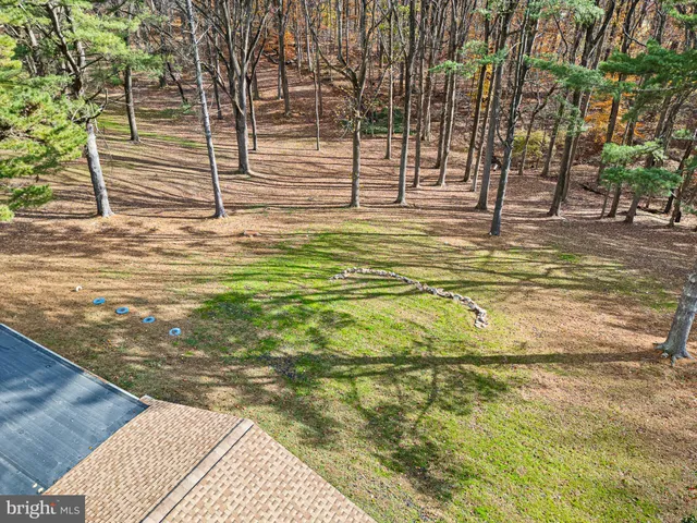 a view of a swimming pool with an outdoor space and seating area