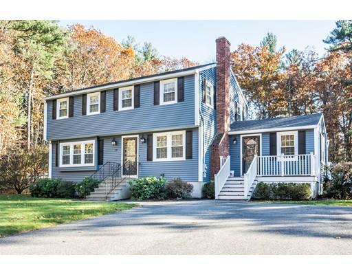 131 Cardigan Road Tewksbury, MA 01876 - Photo 2 of 30 a front view of a house with a yard