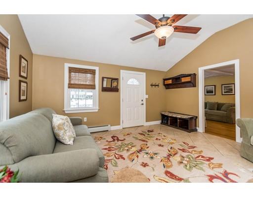 131 Cardigan Road Tewksbury, MA 01876 - Photo 4 of 30 a living room with furniture and a flat screen tv