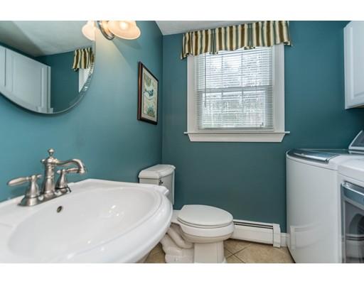 131 Cardigan Road Tewksbury, MA 01876 - Photo 8 of 30 a bathroom with a toilet sink and mirror