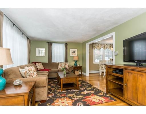131 Cardigan Road Tewksbury, MA 01876 - Photo 9 of 30 a living room with furniture and a flat screen tv