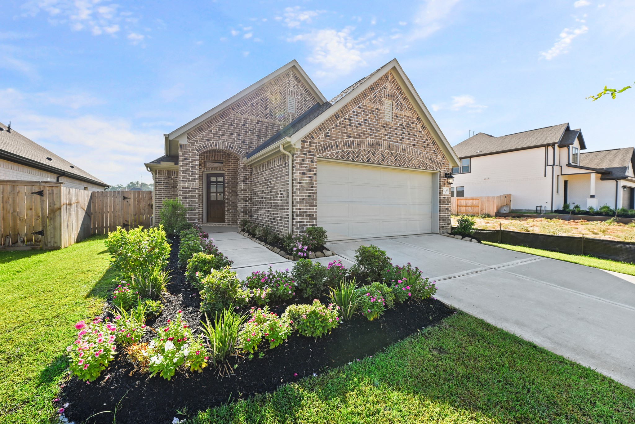 a view of a house with a garden and pathway