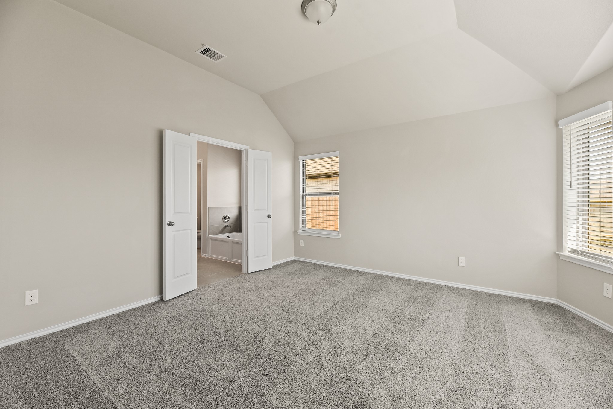 1330 Lakeside Creek Road Magnolia, TX 77354 - Photo 11 of 28 an empty room with windows and closet