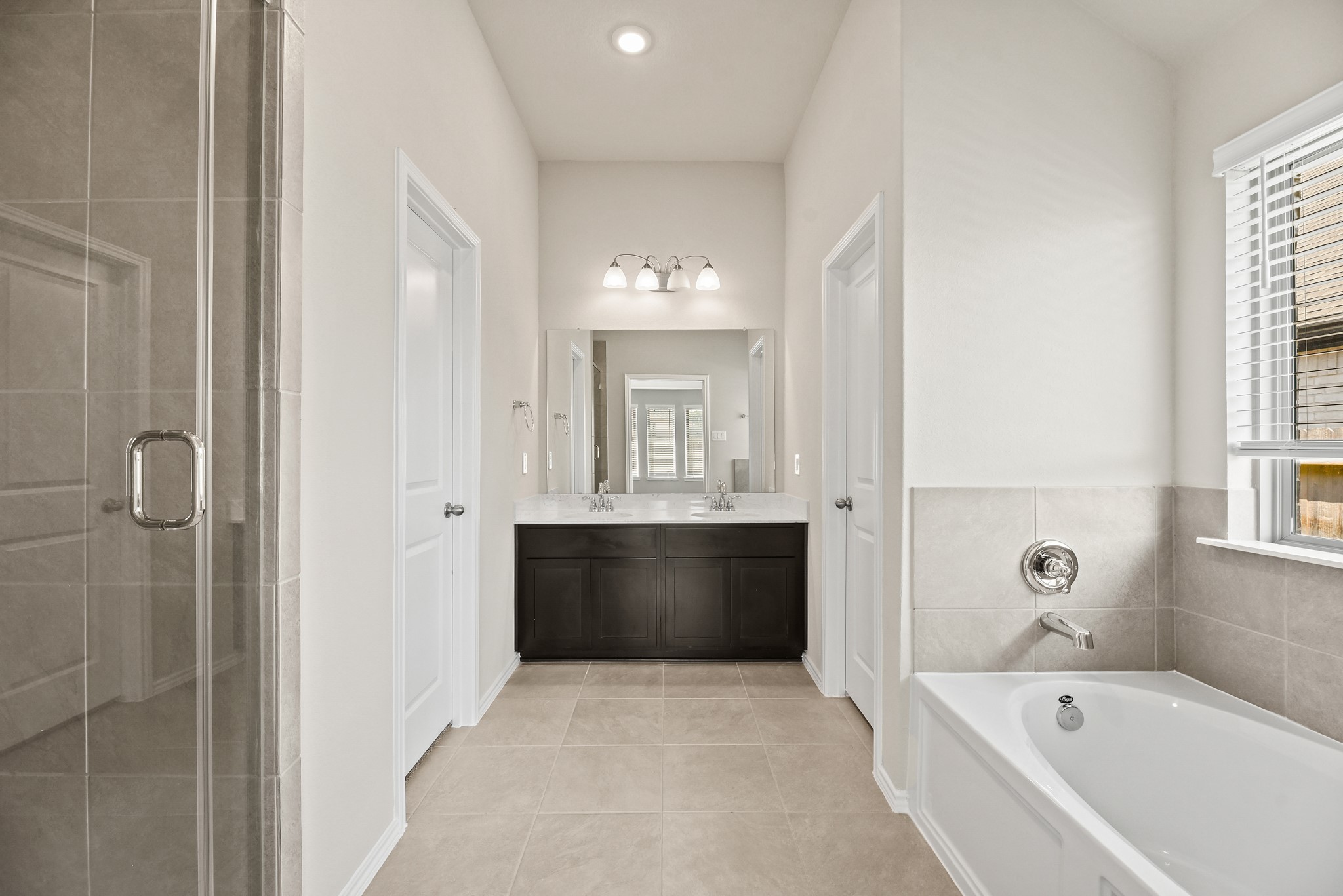 1330 Lakeside Creek Road Magnolia, TX 77354 - Photo 13 of 28 a bathroom with a bathtub shower and sink