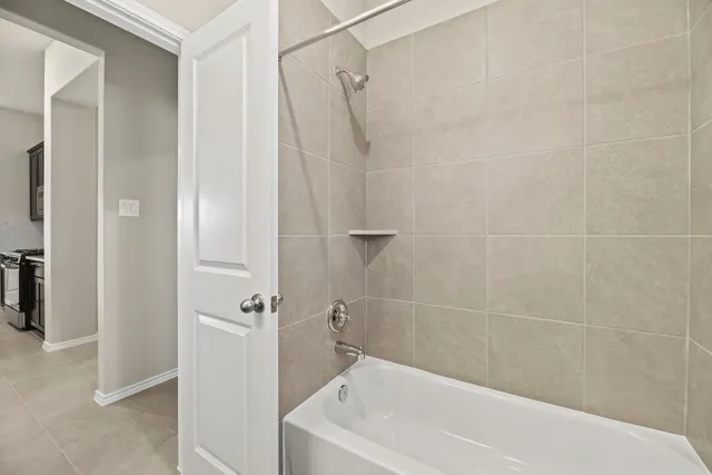 a white bath tub with a shower