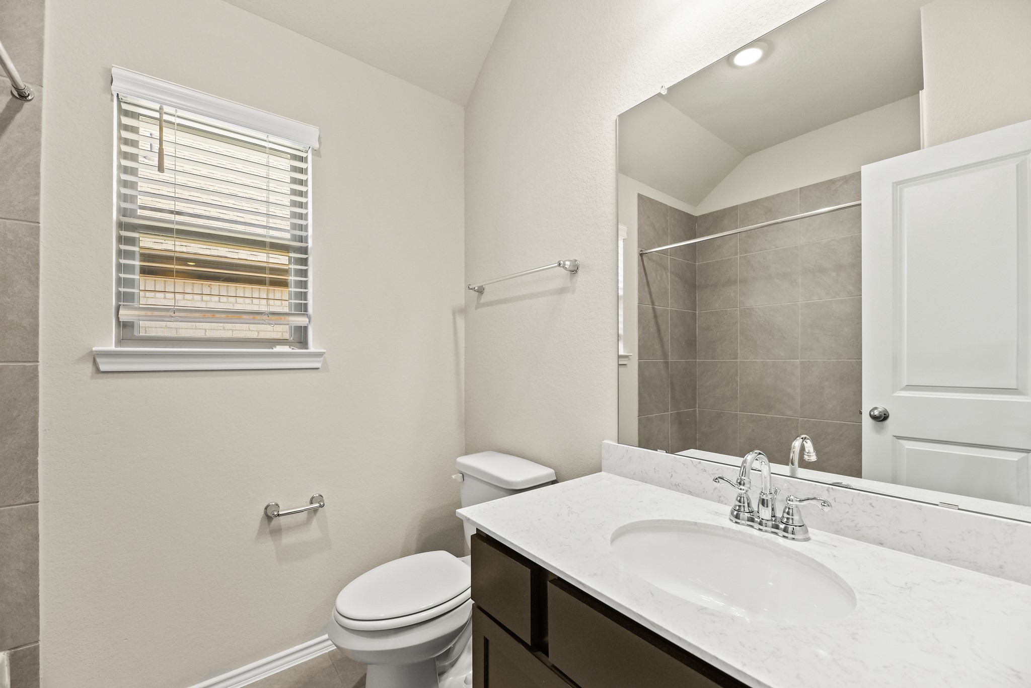 1330 Lakeside Creek Road Magnolia, TX 77354 - Photo 20 of 28 a bathroom with a sink a toilet and a mirror