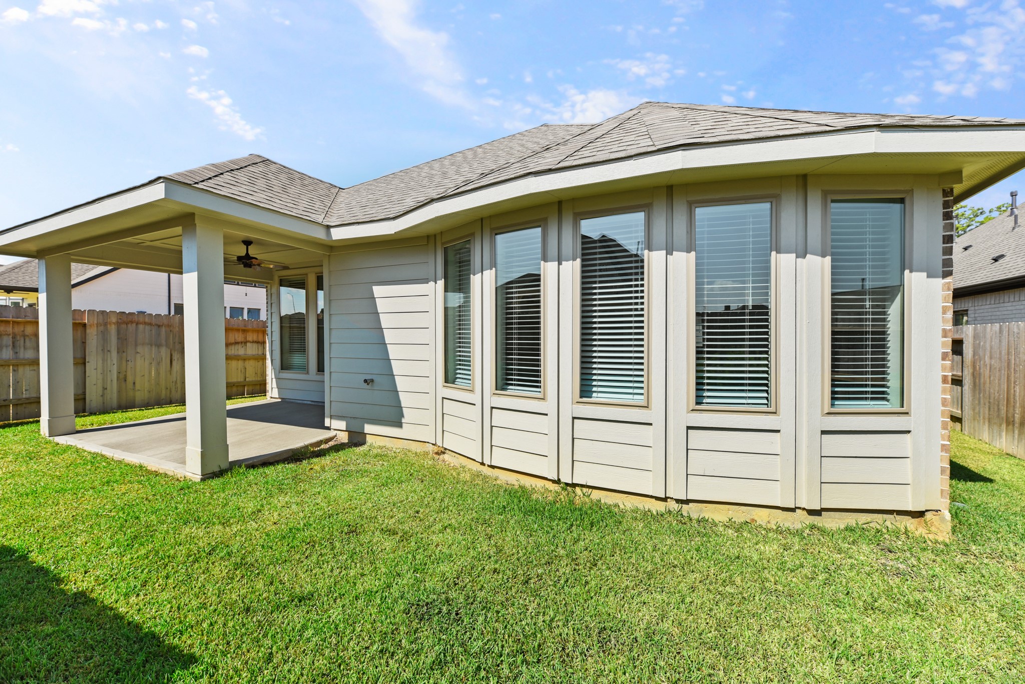 1330 Lakeside Creek Road Magnolia, TX 77354 - Photo 22 of 28 a view of a house with backyard and porch