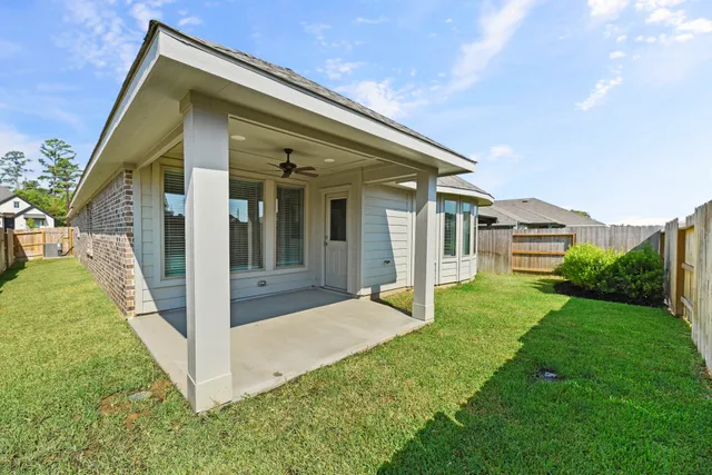 a view of house with backyard