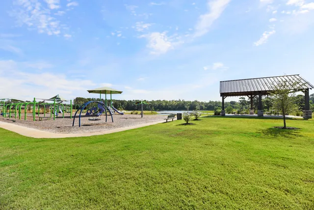 a view of a swimming pool and outdoor seating