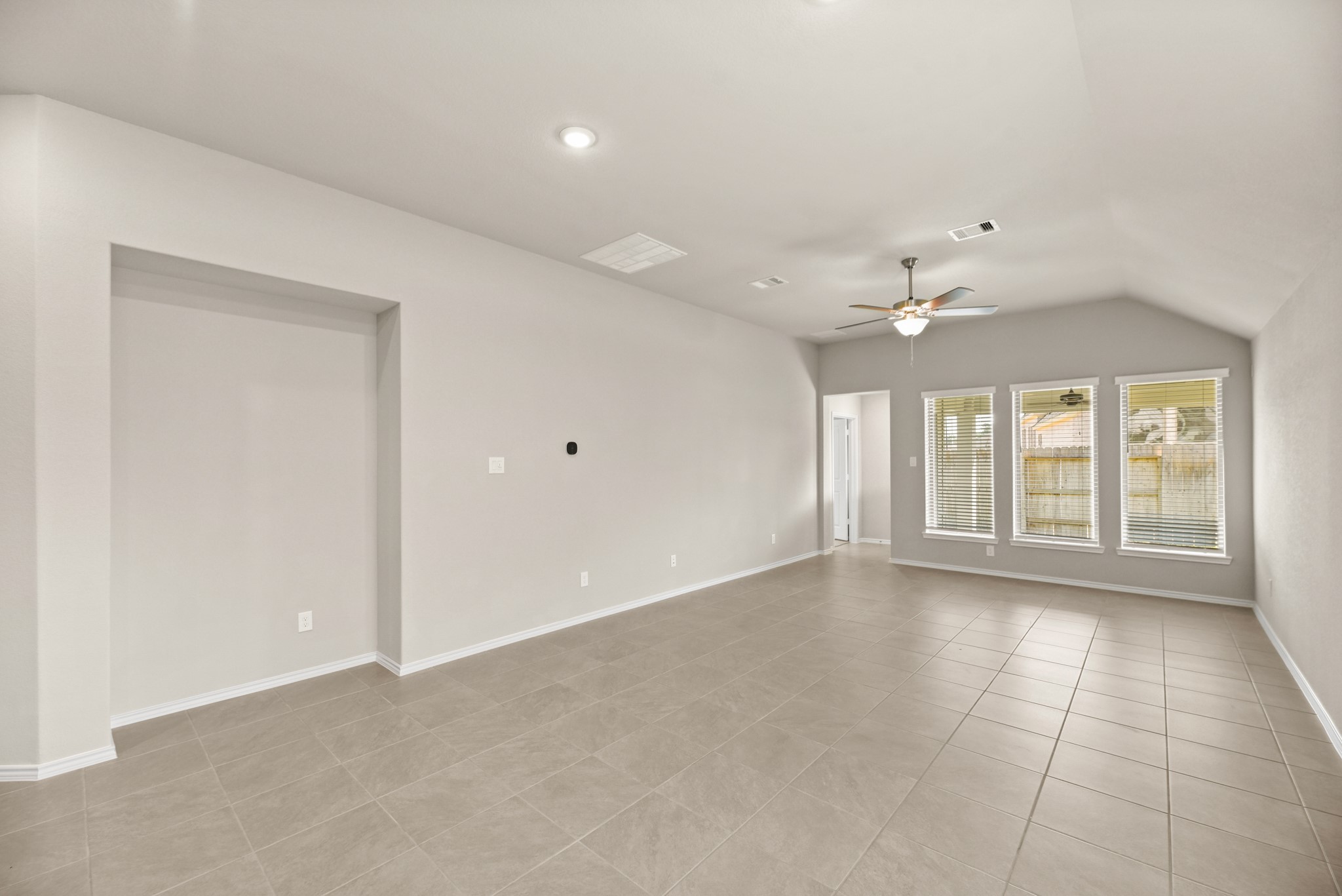 1330 Lakeside Creek Road Magnolia, TX 77354 - Photo 5 of 28 a view of an empty room with a window