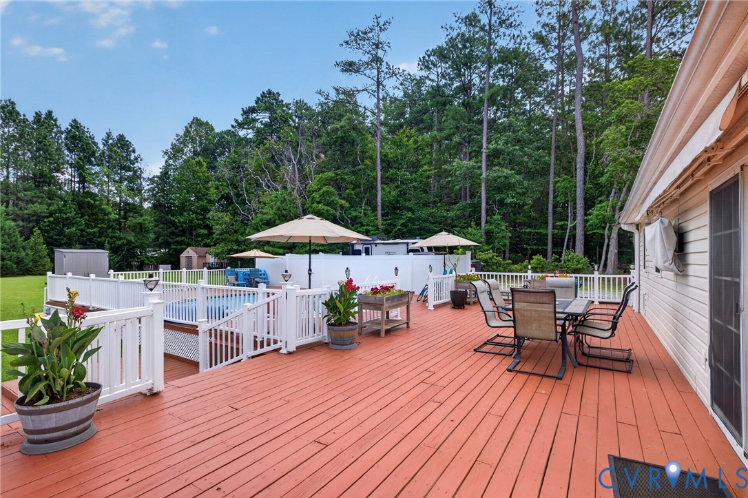 2335 Dorrell Road Aylett, VA 23009 - Photo 17 of 26 Spacious rear deck featuring a red-toned surface,