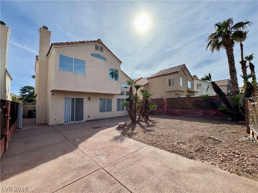 73 Sea Holly Way Henderson, NV 89074 - Photo 43 of 59 Rear view of property featuring a fenced backyard, stucco siding, and a chimney