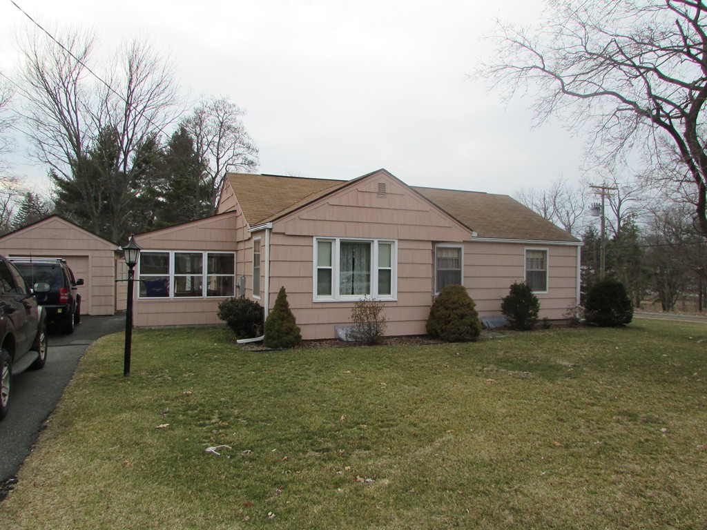 6 Wilshire Road Springfield, MA 01118 - Photo 1 of 10 a view of a house with a yard