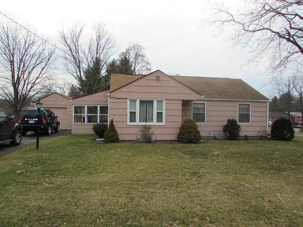 6 Wilshire Road Springfield, MA 01118 - Photo 2 of 10 a front view of a house with a garden