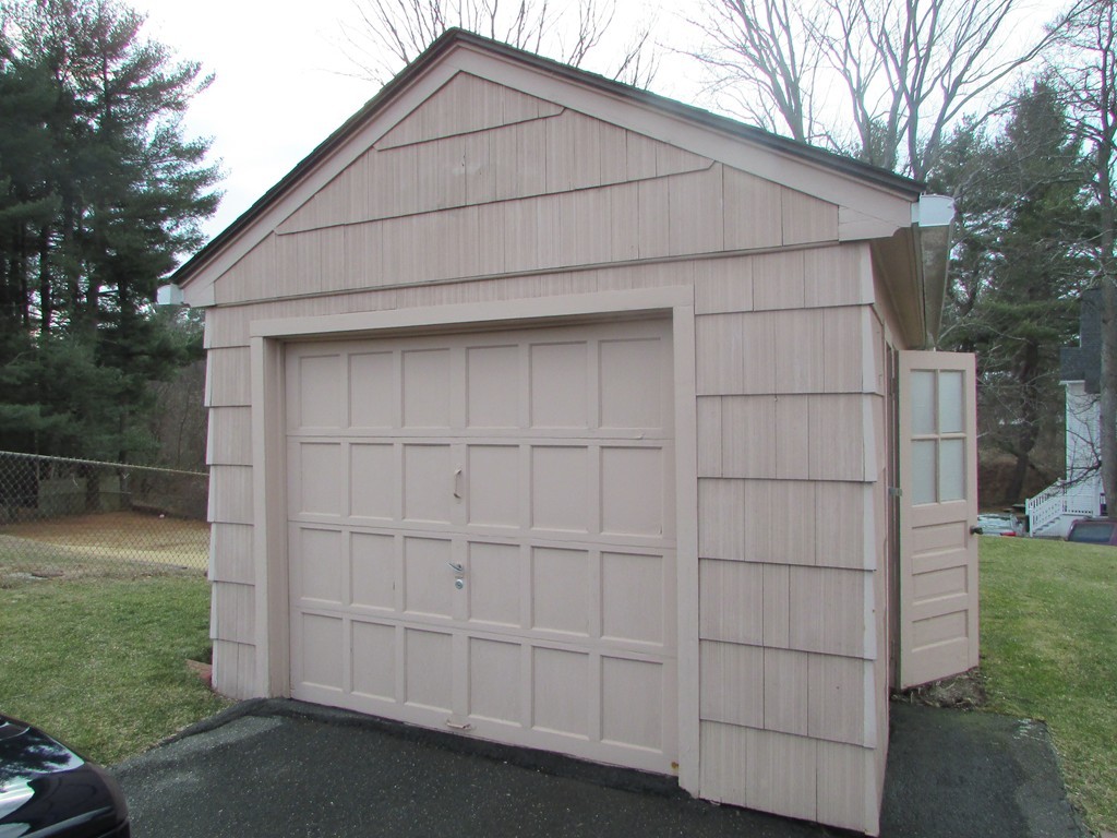 6 Wilshire Road Springfield, MA 01118 - Photo 4 of 10 a front view of a house with a yard
