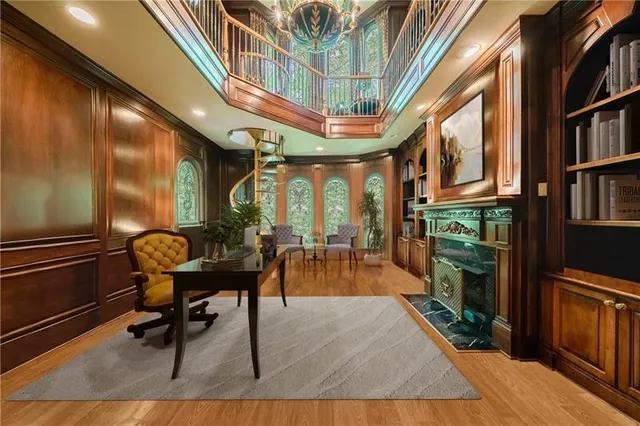 a spacious bedroom with a bed and a chandelier