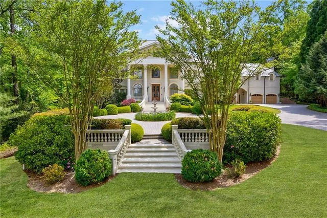 a front view of a house with garden