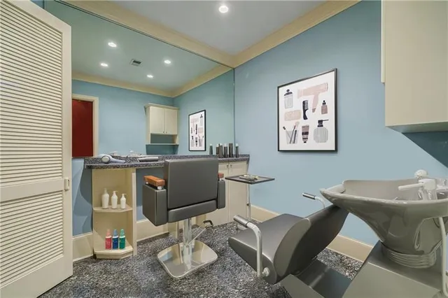 a living room with furniture fireplace and a large window