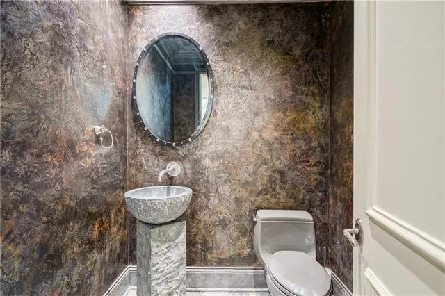 a living room with patio furniture and a large window