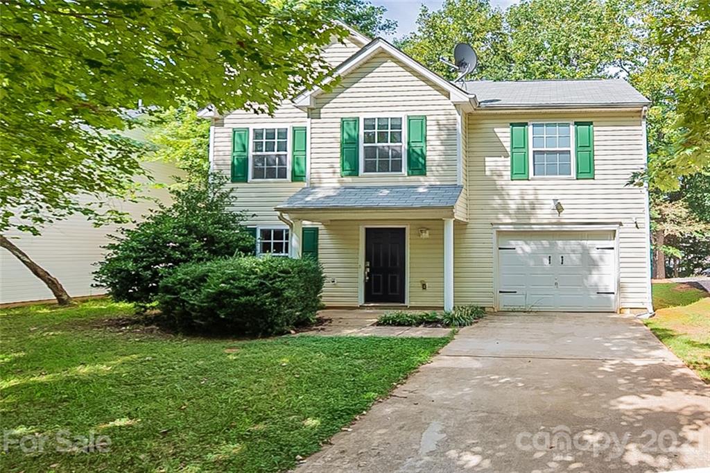1827 Endeavor Lane Clover, SC 29710 - Photo 1 of 18 a front view of a house with a garden and yard