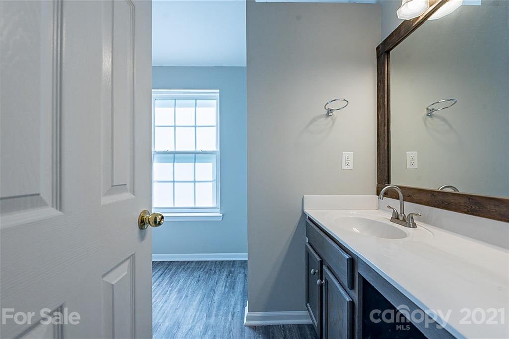1827 Endeavor Lane Clover, SC 29710 - Photo 13 of 18 a bathroom with a sink and a mirror