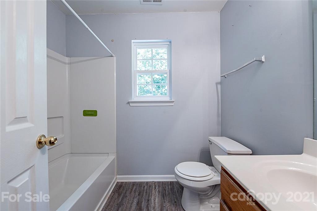 1827 Endeavor Lane Clover, SC 29710 - Photo 14 of 18 a white toilet sitting next to a bath tub