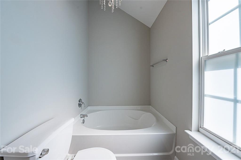 1827 Endeavor Lane Clover, SC 29710 - Photo 15 of 18 a white bath tub sitting next to a window