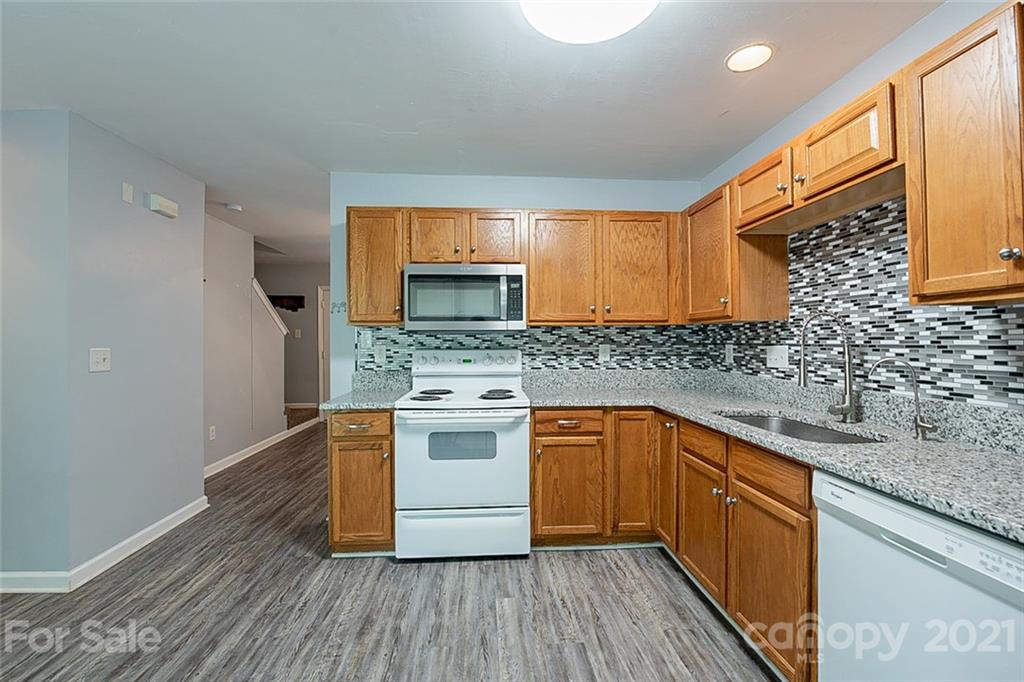 1827 Endeavor Lane Clover, SC 29710 - Photo 6 of 18 a kitchen with stainless steel appliances granite countertop a sink stove and cabinets