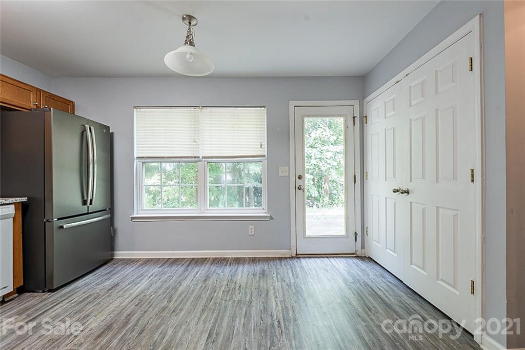 1827 Endeavor Lane Clover, SC 29710 - Photo 8 of 18 a view of an empty room with wooden floor and a window