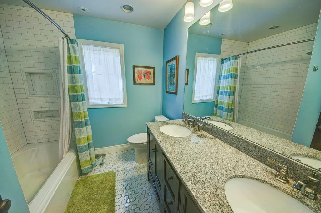 404 Gass Road Wexford, PA 15090 - Photo 15 of 20 Newly finished main bathroom highlighted by double vanity granite sink, classic subway tile, and a cast-iron tub.