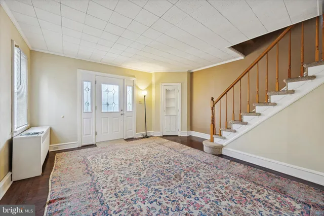 a view of an entryway with wooden floor