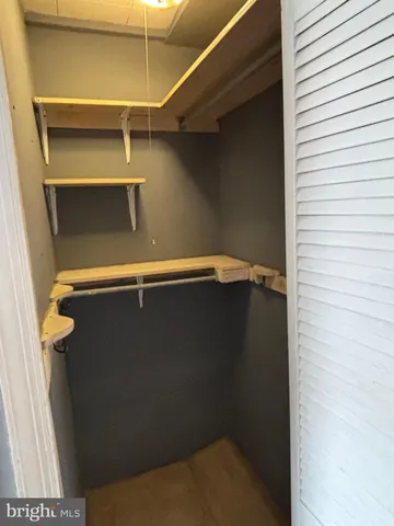 a view of room with air conditioner and window