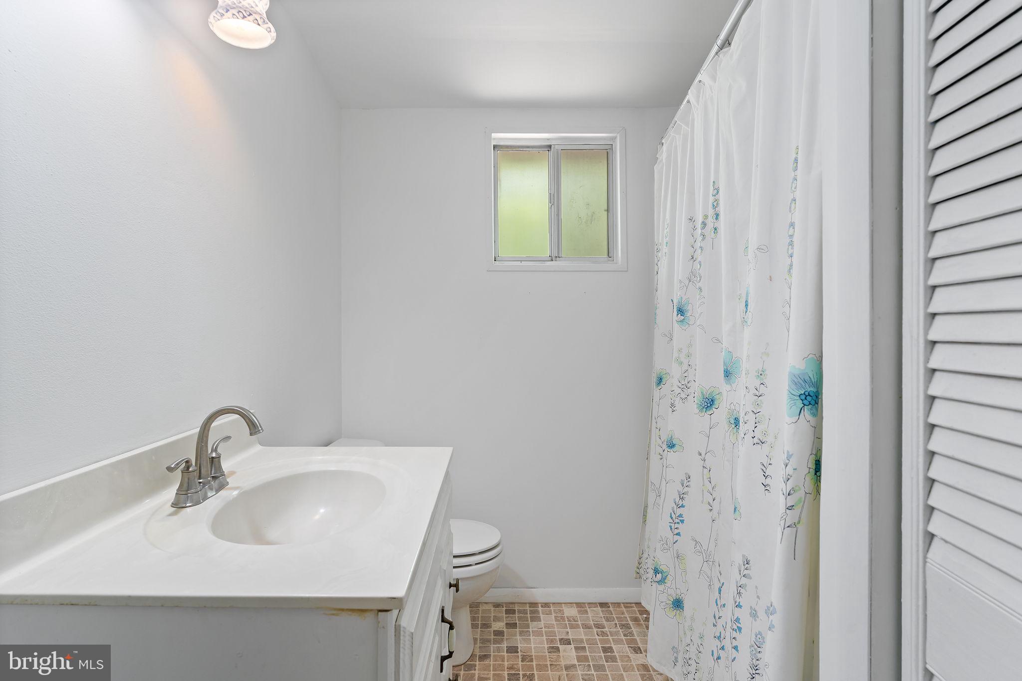 152 Edgemont Circle Locust Grove, VA 22508 - Photo 17 of 60 a bathroom with a sink a toilet and shower