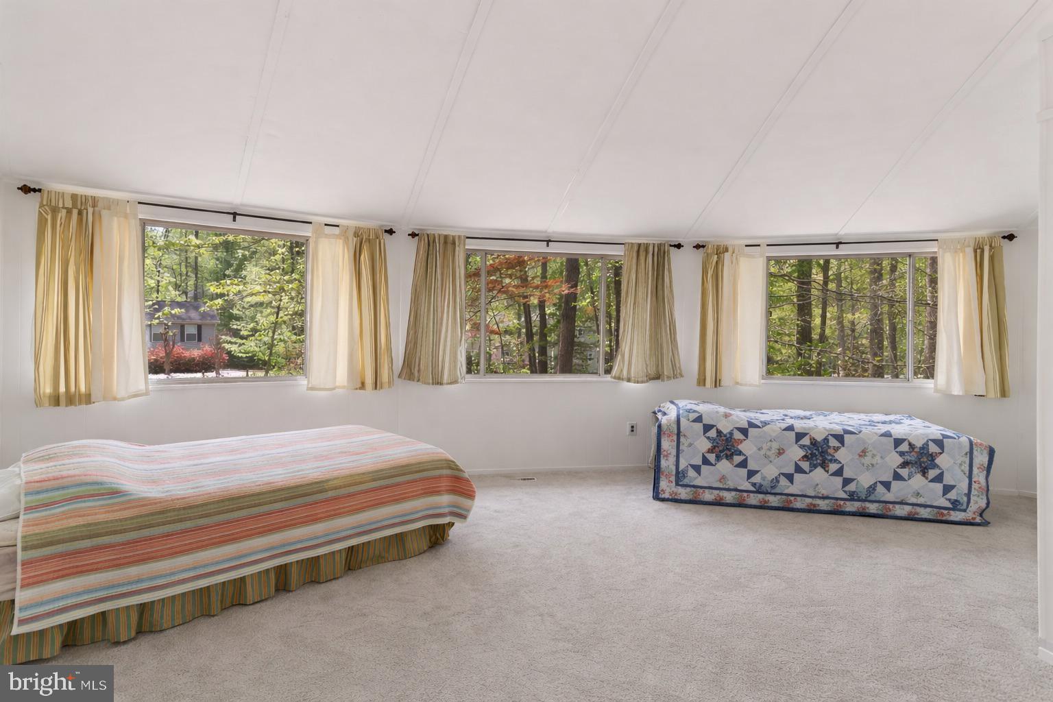 152 Edgemont Circle Locust Grove, VA 22508 - Photo 24 of 60 a bedroom with a large bed and a couch with window
