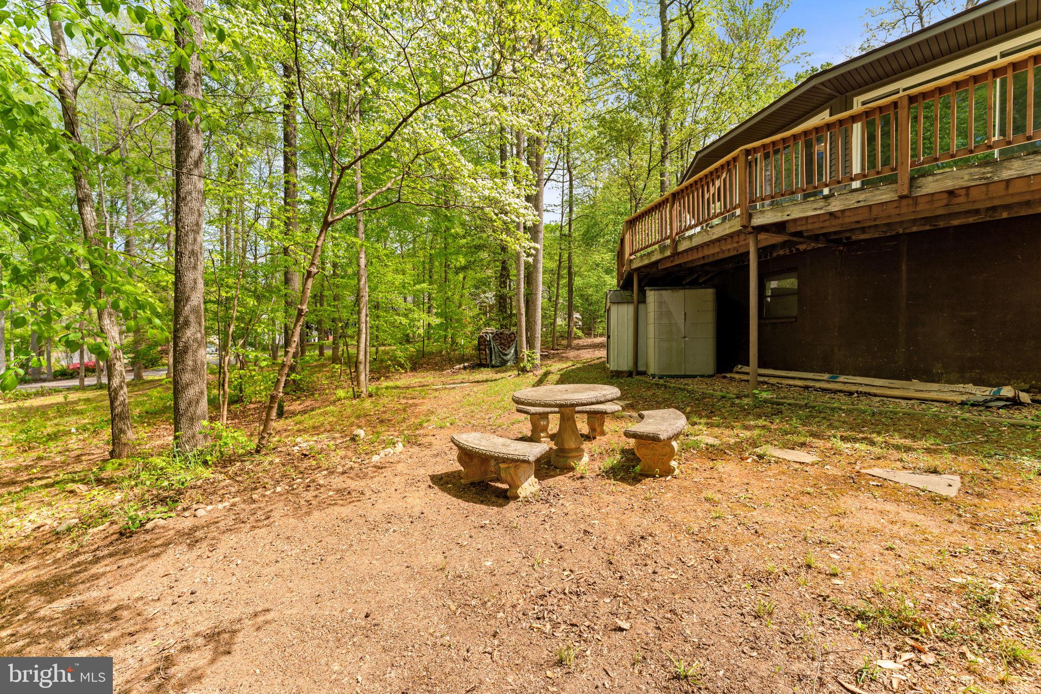 152 Edgemont Circle Locust Grove, VA 22508 - Photo 41 of 60 a backyard of a house with table and chairs