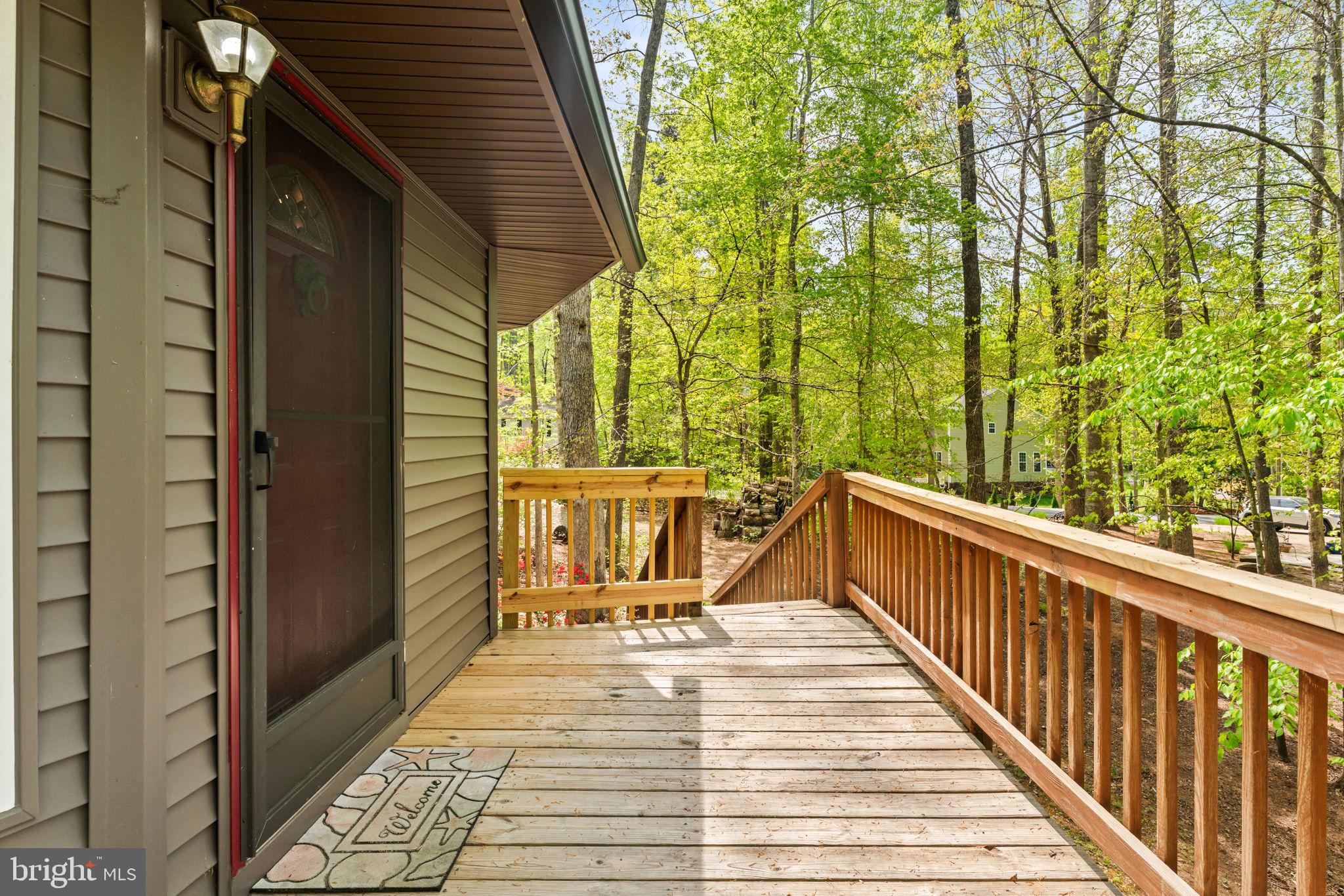 152 Edgemont Circle Locust Grove, VA 22508 - Photo 5 of 60 a view of balcony with wooden floor and outdoor seating