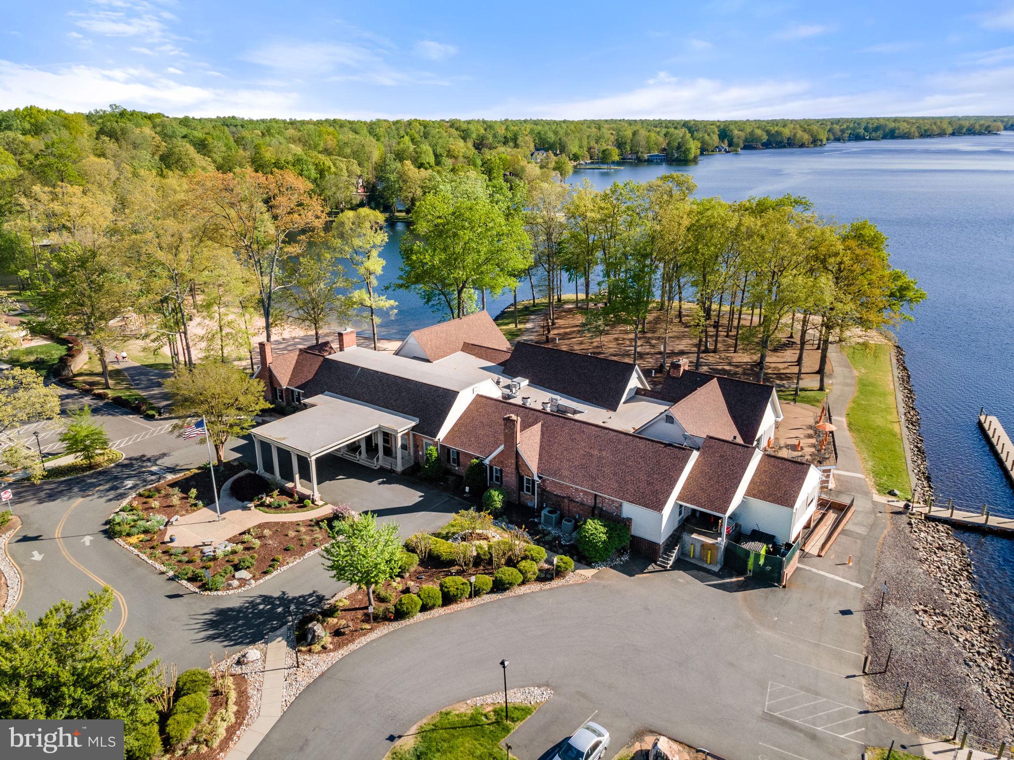 152 Edgemont Circle Locust Grove, VA 22508 - Photo 52 of 60 an aerial view of a house with a lake view