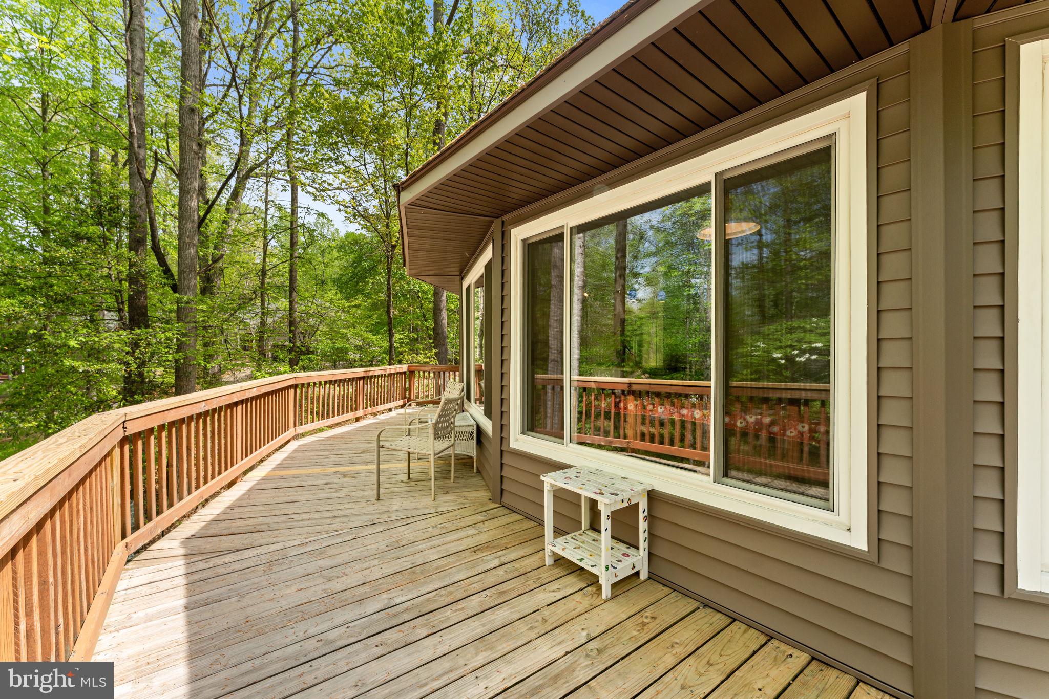 152 Edgemont Circle Locust Grove, VA 22508 - Photo 7 of 60 a balcony with wooden floor and outdoor seating