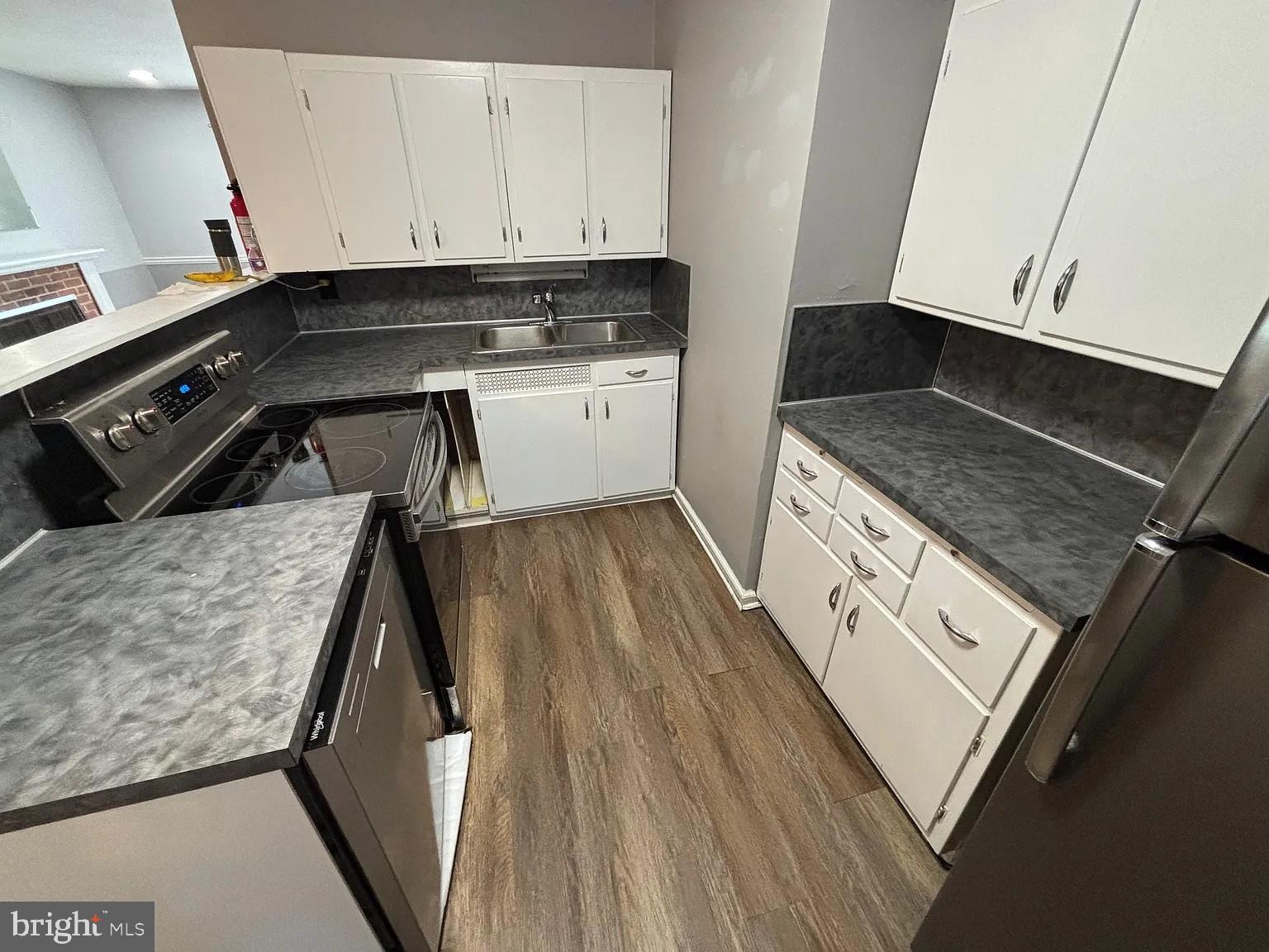 336 Hillside Road King of Prussia, PA 19406 - Photo 12 of 17 a kitchen with a stove and white cabinets