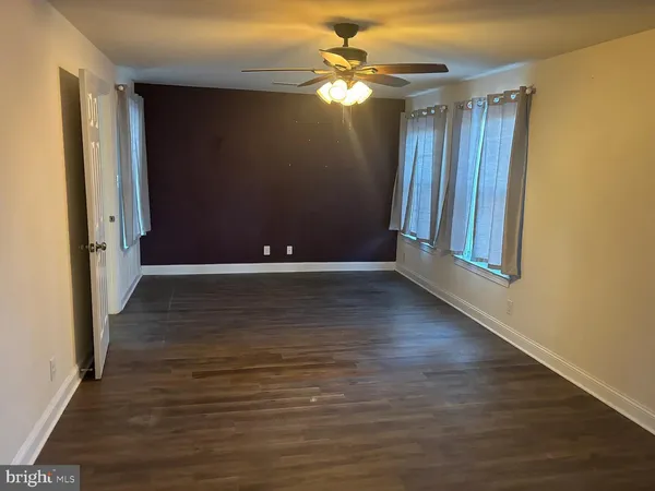 a bathroom with a double vanity sink toilet and shower