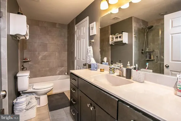 an empty room with wooden floor and fireplace