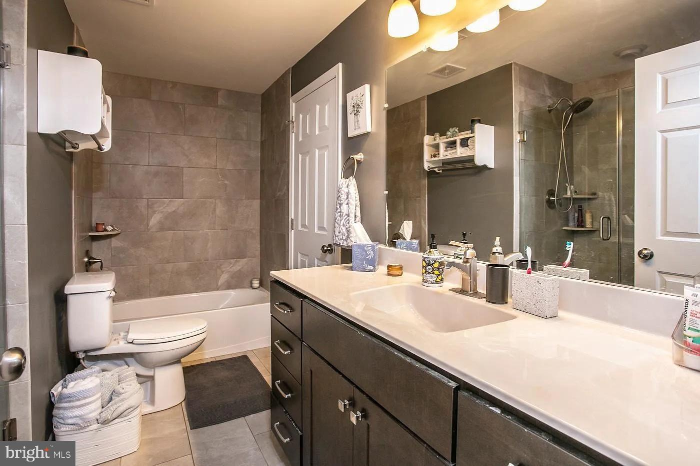 336 Hillside Road King of Prussia, PA 19406 - Photo 7 of 17 a bathroom with a double vanity sink toilet and shower