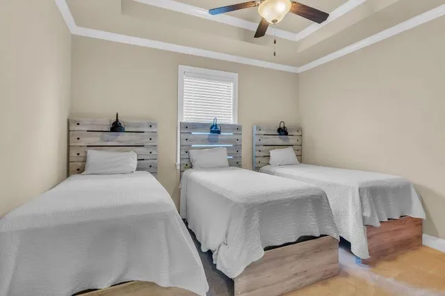 a bathroom with a double vanity sink and a toilet