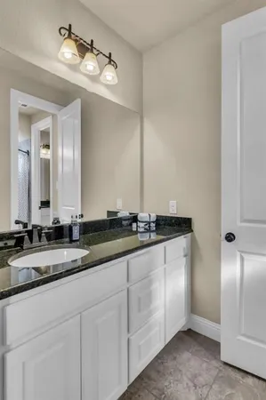 a bed room with a bed and a chair