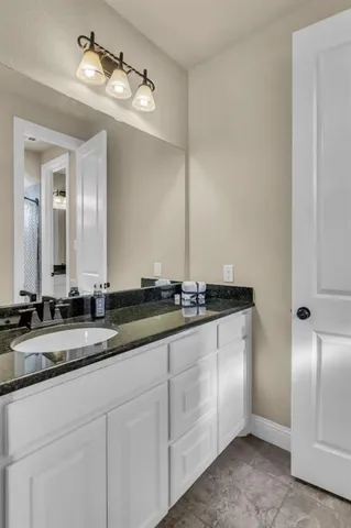 a bed room with a bed and a chair