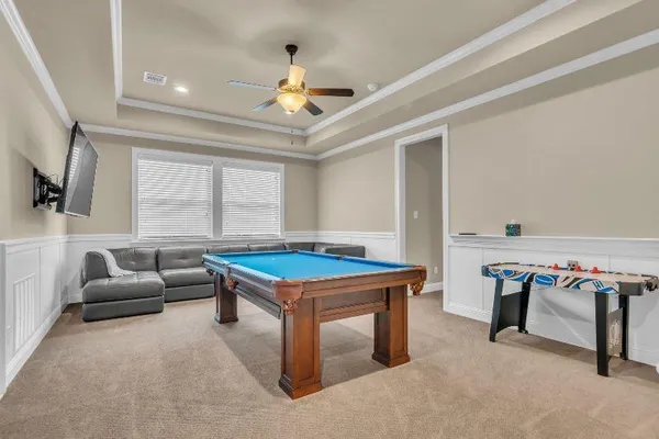 a bedroom with a bed and a couch