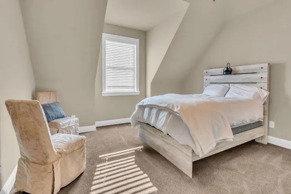 a bathroom with a granite countertop sink a toilet and a mirror