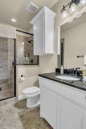 a work room with furniture and wooden floor