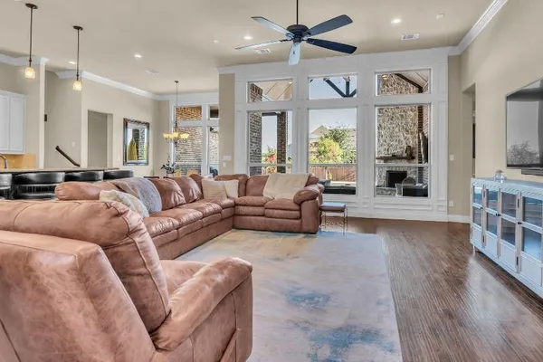 a living room with furniture window and wooden floor